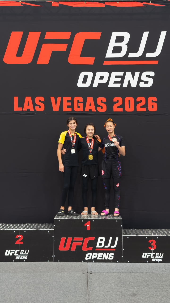 Bailey Heinsohn on the first-place podium after winning gold in the Girls NoGi Teen I Youth 95 Advanced division at the 2026 UFC BJJ Open in Las Vegas.