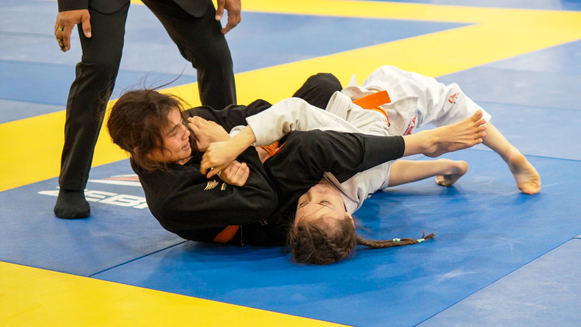 Bailey Heinsohn applying an armbar against Jazmyn Alexis Lopez during the Gi final at the 2026 IBJJF Jiu-Jitsu CON in Las Vegas.