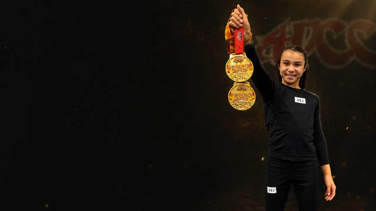 Bailey Heinsohn holding two gold medals after winning the Girls 11–12 Advanced 44 kg and Girls 13–14 Advanced 40 kg divisions at the 2026 ADCC US Open in Phoenix