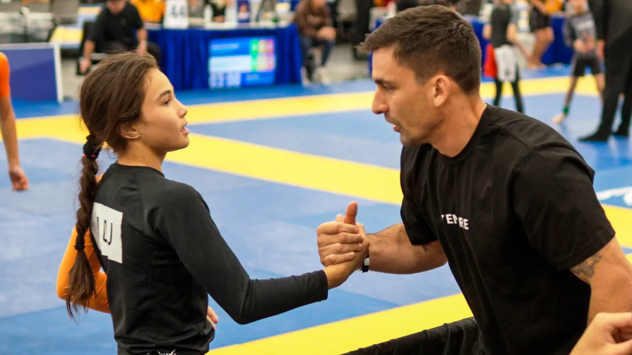 Bailey Heinsohn shares a post-match moment with professor Giu Mendez during the 2026 IBJJF Jiu-Jitsu CON weekend in Las Vegas.